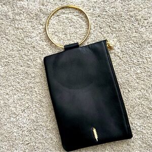 Thacker Nolita clutch in Black with gold bracelet ring